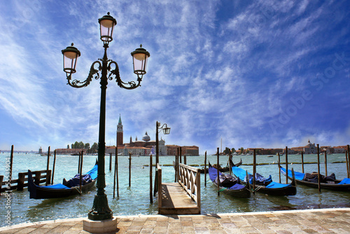 Venice lagoon. Gondolas moored by Saint Mark square