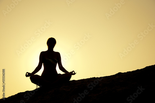 Seaside yoga poses at sunrise