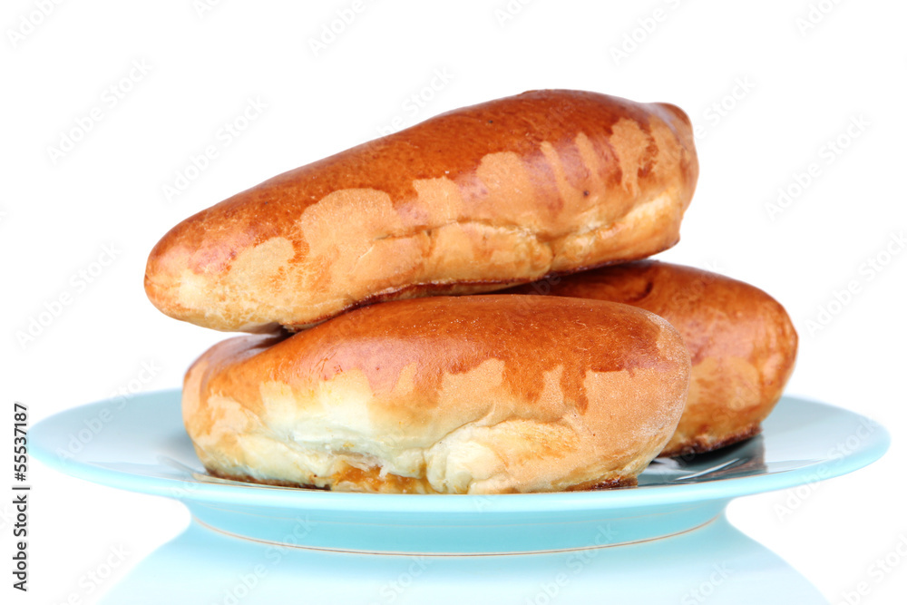 Fresh baked pasties on plate, isolated on white Fresh baked pasties on plate, isolated on white