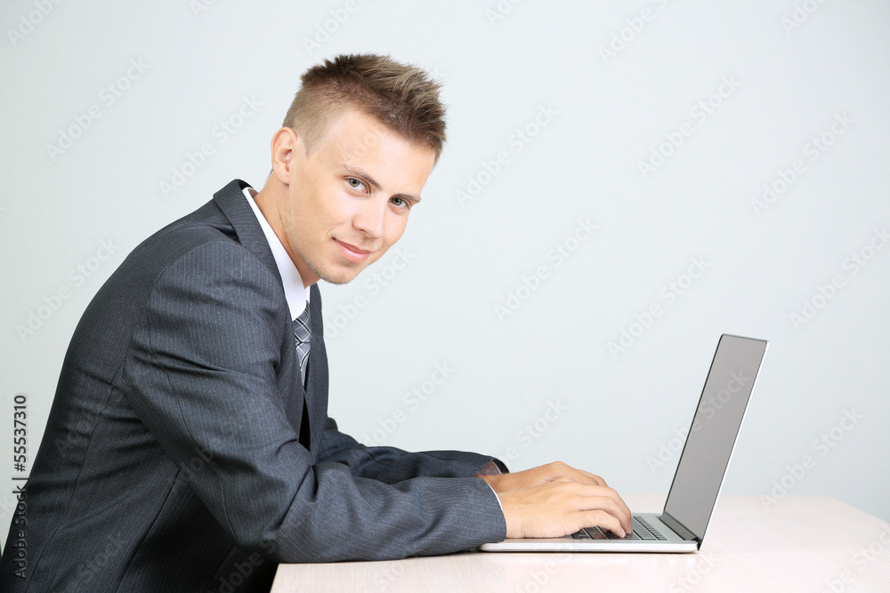 Portrait of young businessman working in office Portrait of young businessman working in office