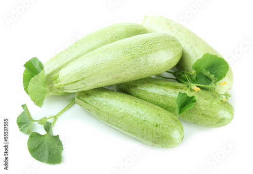 Raw zucchini with leaves, isolated on white