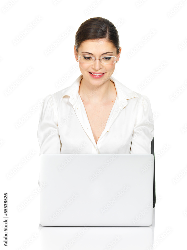 woman sits from the table with laptop in white shirt woman sits from the table with laptop in white shirt