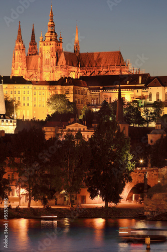 Prague gothic Castle above River Vltava after sunset