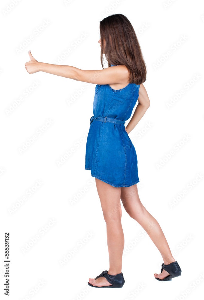 Back view of woman thumbs up. Back view of woman thumbs up.