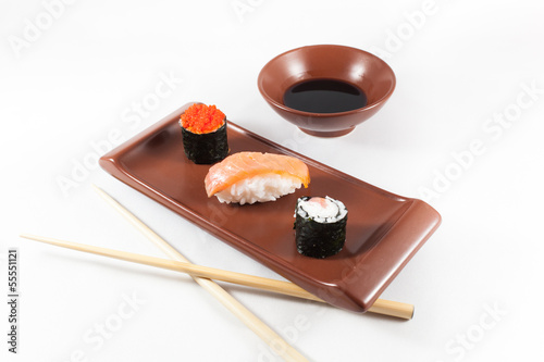 Sushi menu with wasabi, soy sauce and chopsticks