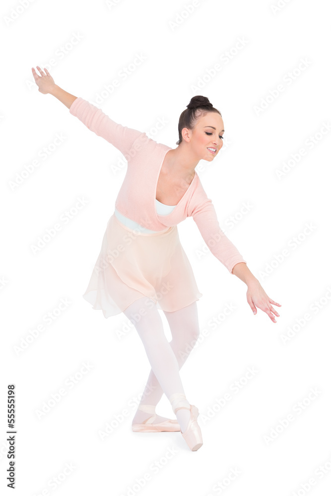 Smiling attractive ballerina dancing