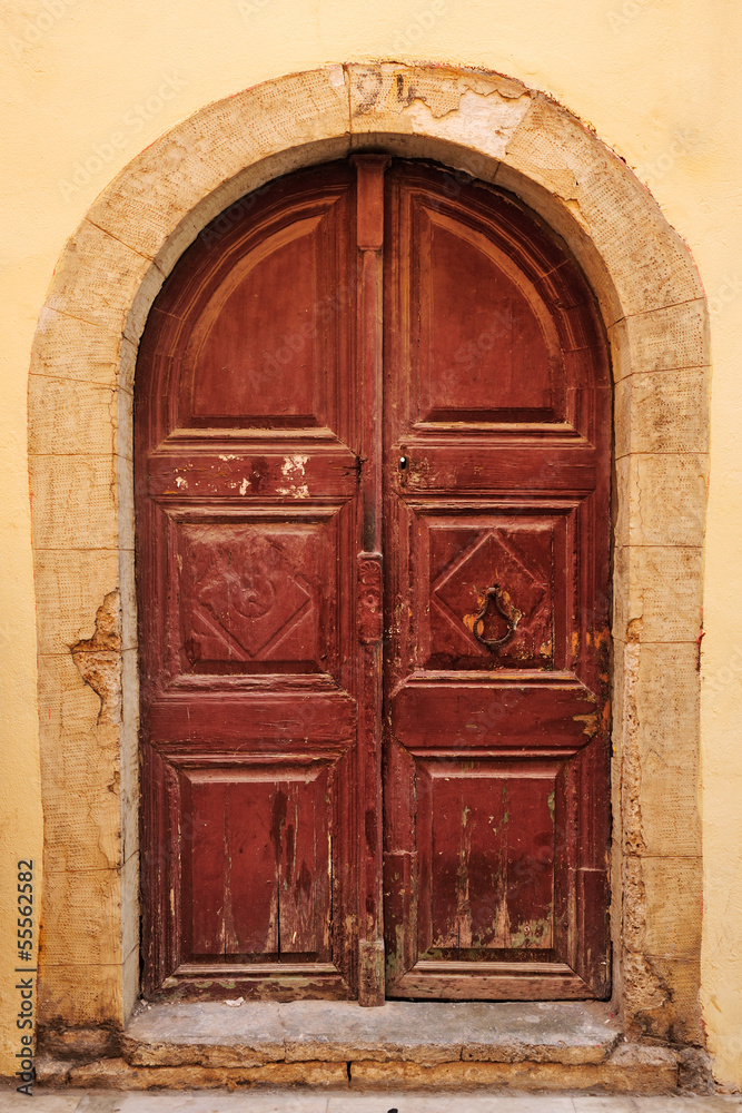 Old wooden door in city of Rethymno, Crete, Greece