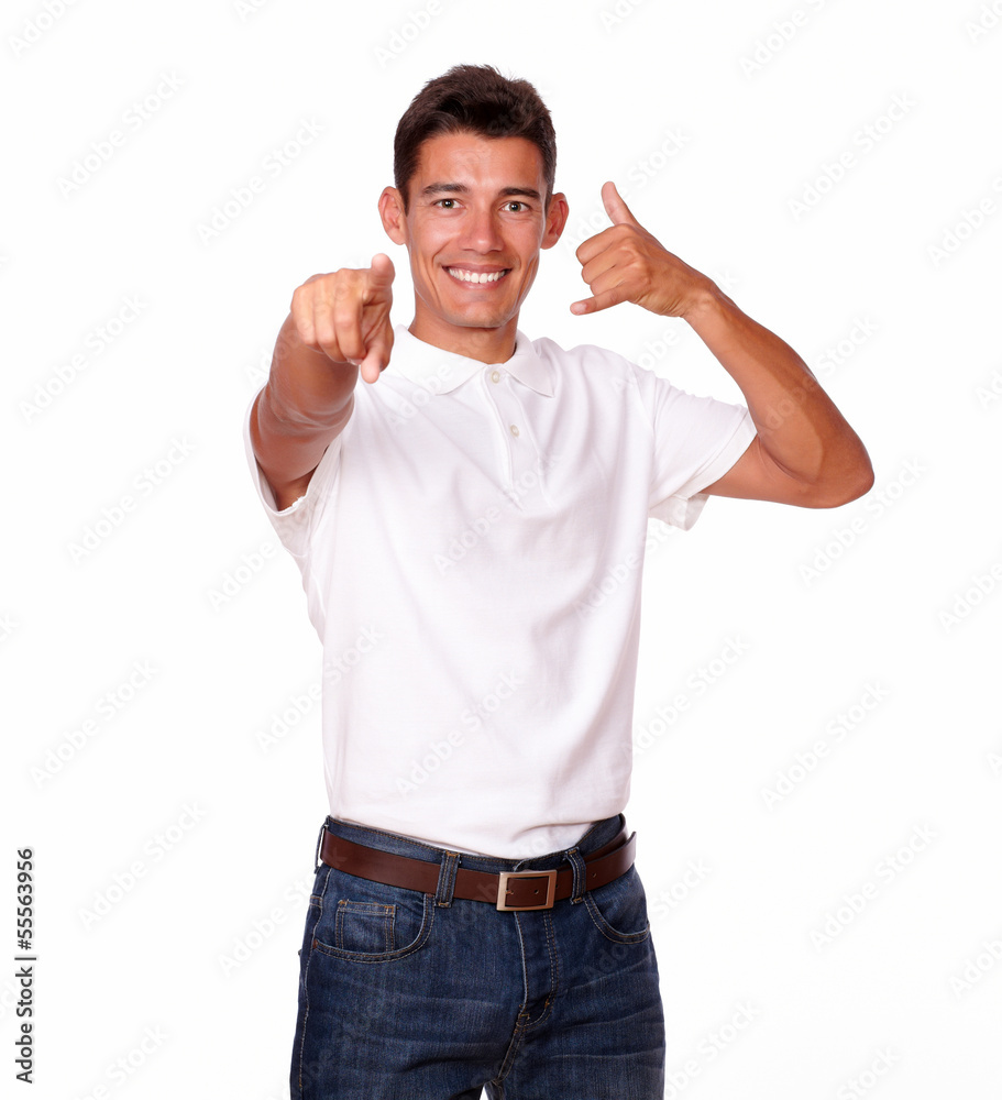 Handsome man in a studio pointing at you. Handsome man in a studio pointing at you.