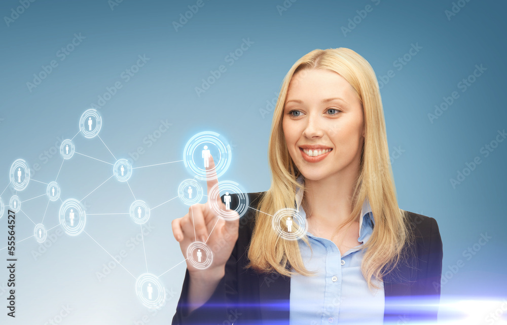 businesswoman pressing button with contact