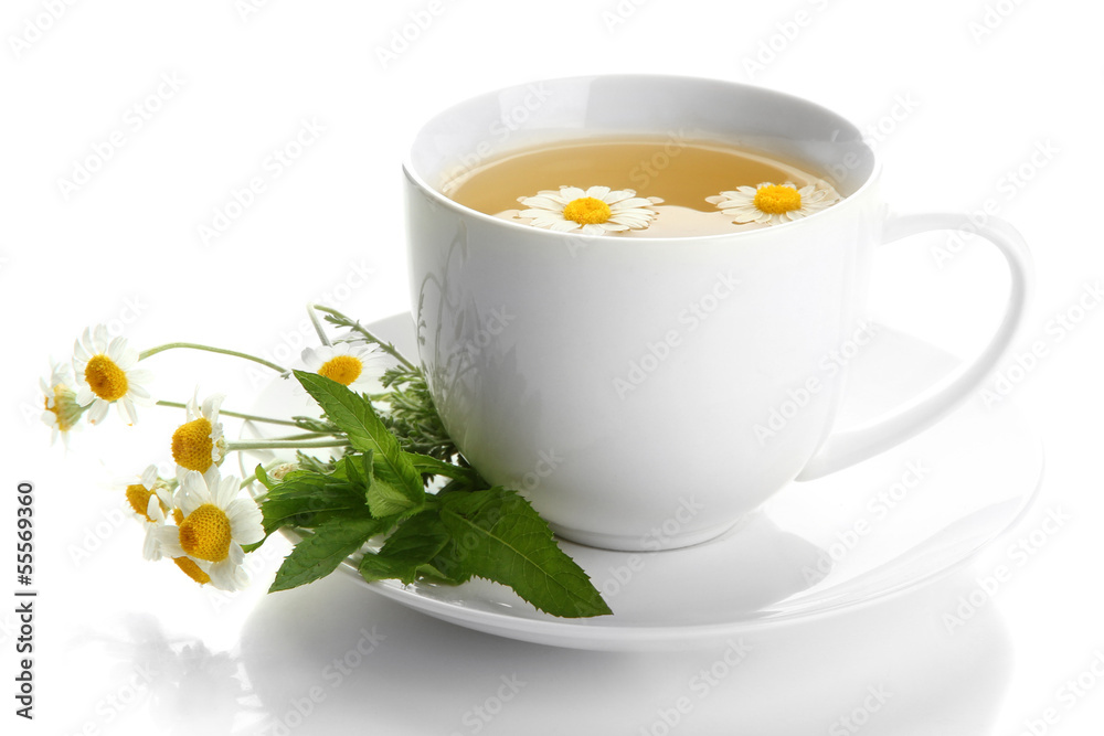 Cup of herbal tea with wild camomiles and mint, isolated Cup of herbal tea with wild camomiles and mint, isolated
