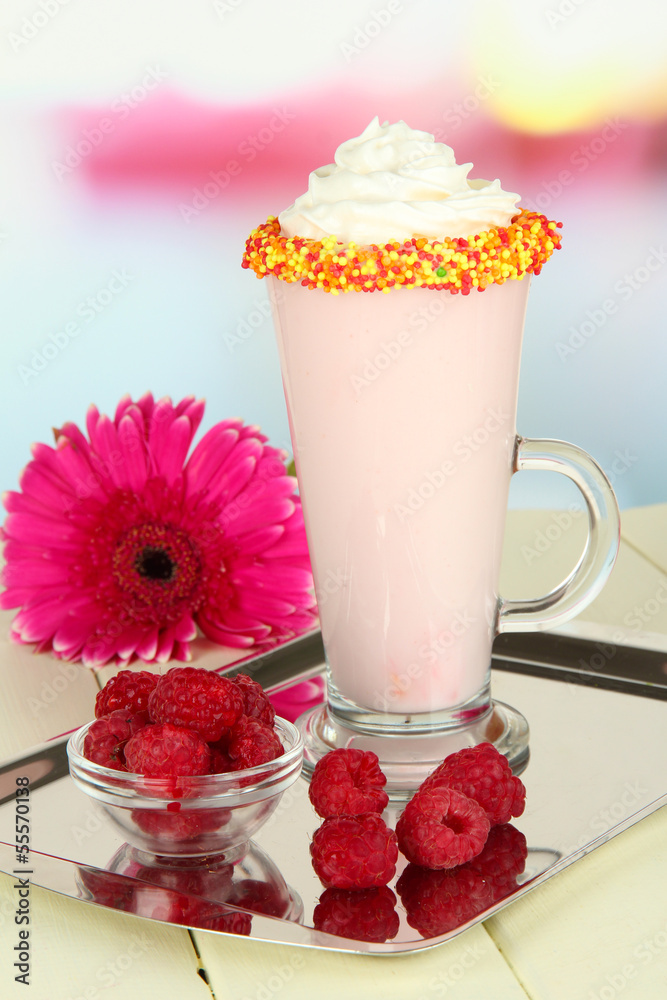 Delicious milk shake on table on light background Delicious milk shake on table on light background