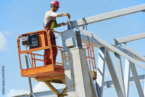 builder millwright worker at construction site photo