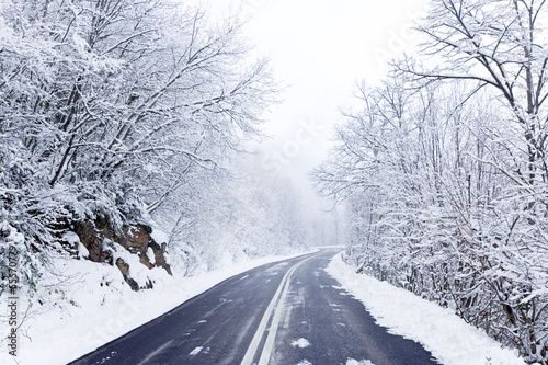 Snowy winter road © yiorgosgr