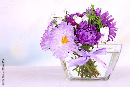 Fototapeta Naklejka Na Ścianę i Meble -  Beautiful bouquet of bright flowers in glass vase,