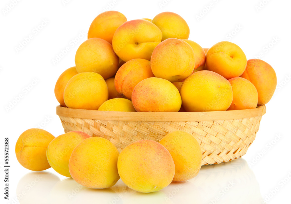 Fresh natural apricot in wicker basket isolated on white Fresh natural apricot in wicker basket isolated on white