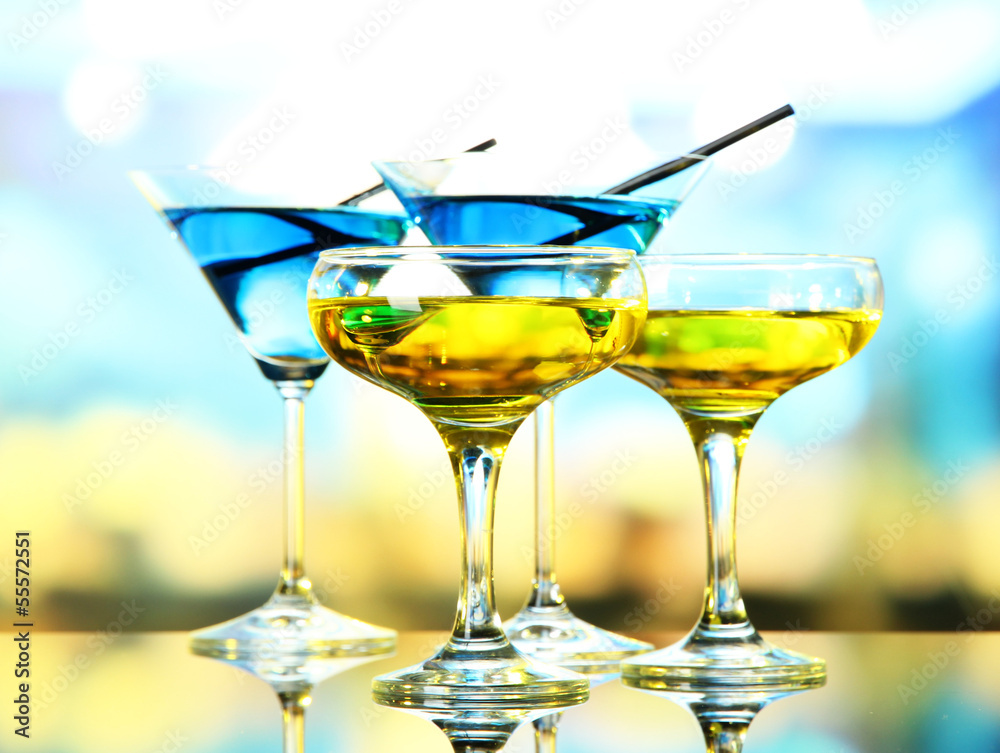 Glasses of cocktails on bright background Glasses of cocktails on bright background