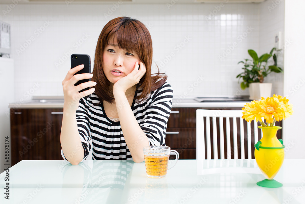 young asian woman relaxing in the kitchen young asian woman relaxing in the kitchen