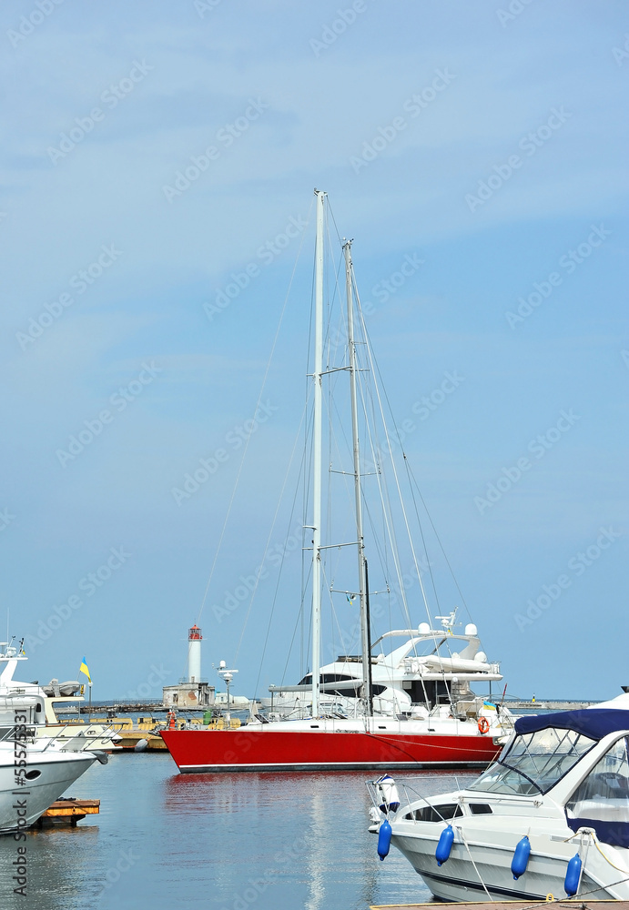 Red and white motor yacht over harbor pier, Odessa, Ukraine