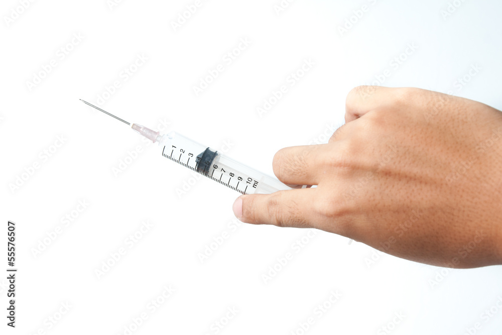 Fototapeta premium Hand holding syringe