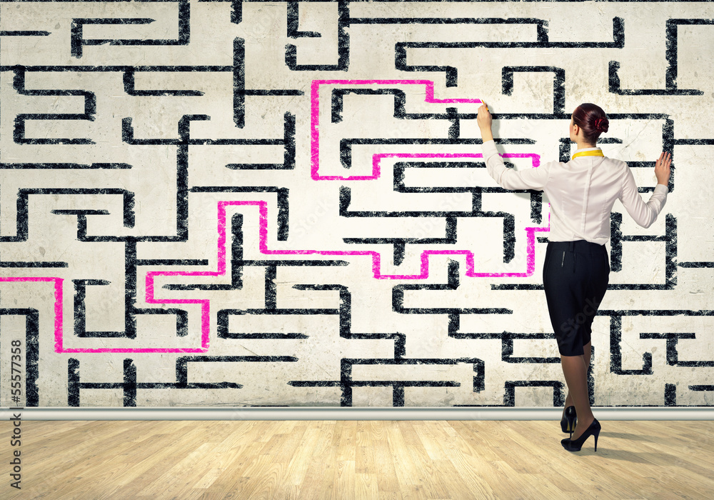 Businesswoman solving maze problem Businesswoman solving maze problem