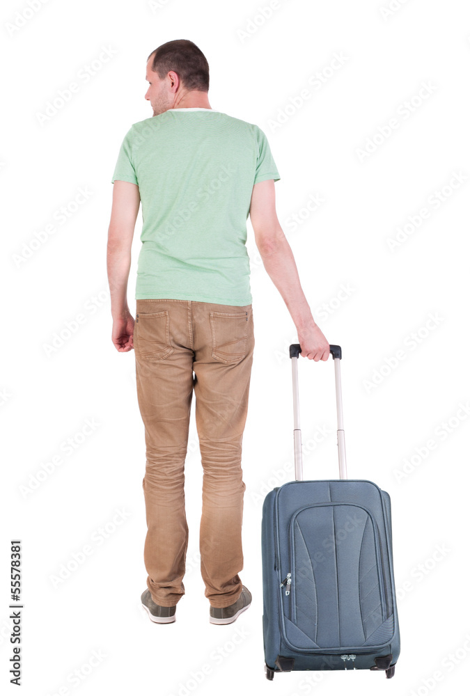 Back view of man with  suitcase looking up