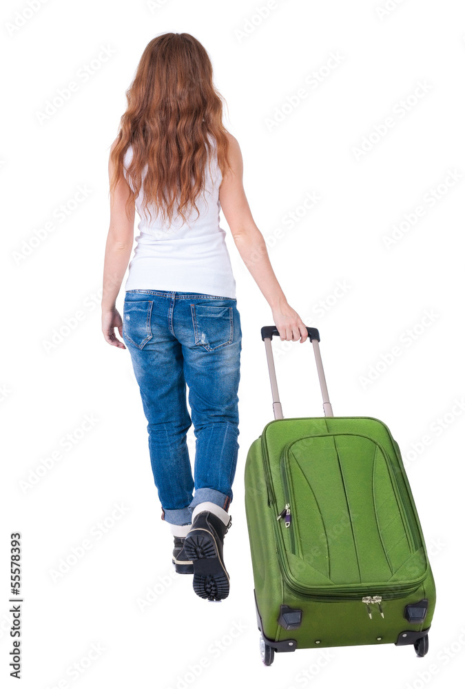 back view of walking woman with suitcase back view of walking woman with suitcase