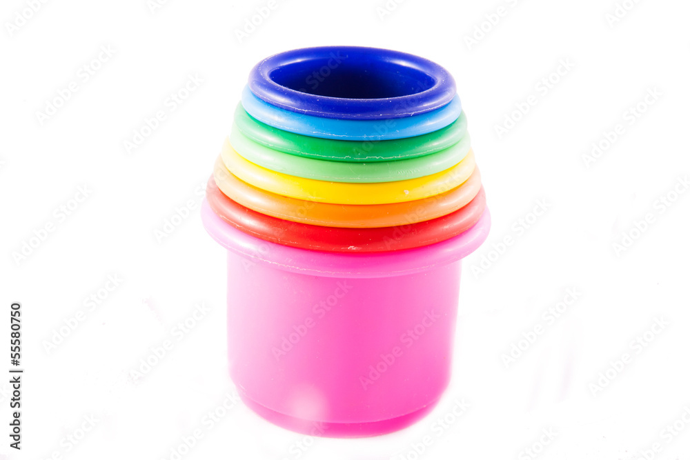 Cups to build a tower as toy for children on white Cups to build a tower as toy for children on white