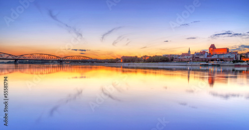 Torun old town reflected in Vistula river at sunset, Poland © Patryk Kosmider