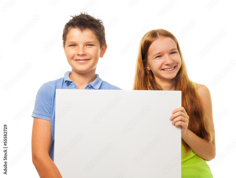 Two happy kids with sign