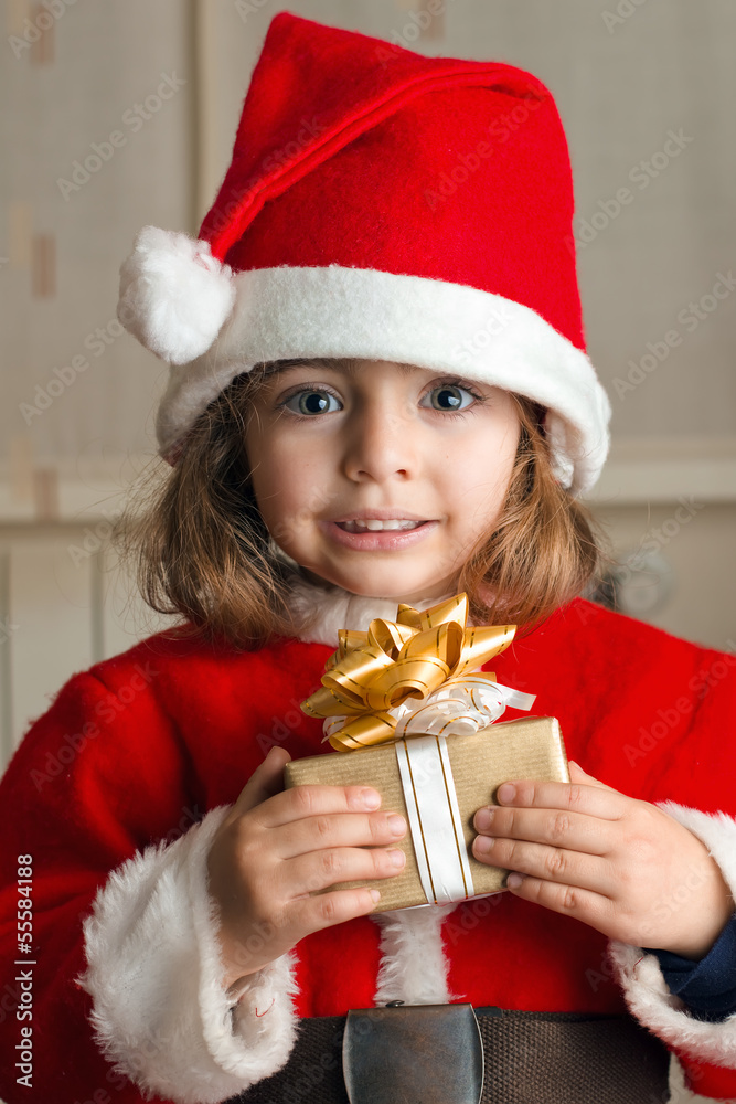 little Christmas girl with a present little Christmas girl with a present