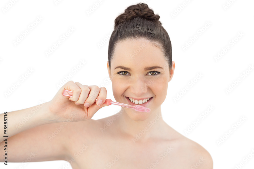 Cheerful pretty model brushing her teeth Cheerful pretty model brushing her teeth
