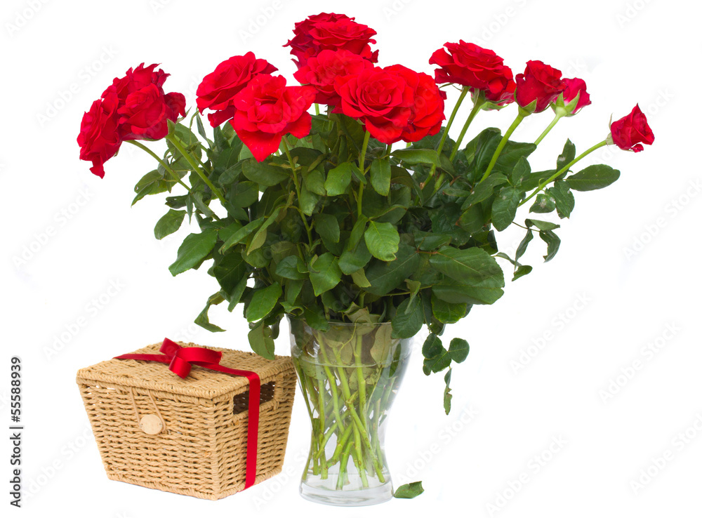 bunch of red roses in vase with gift basket