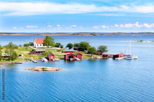 Foto Small village with red buildings in Finnish archipelago
