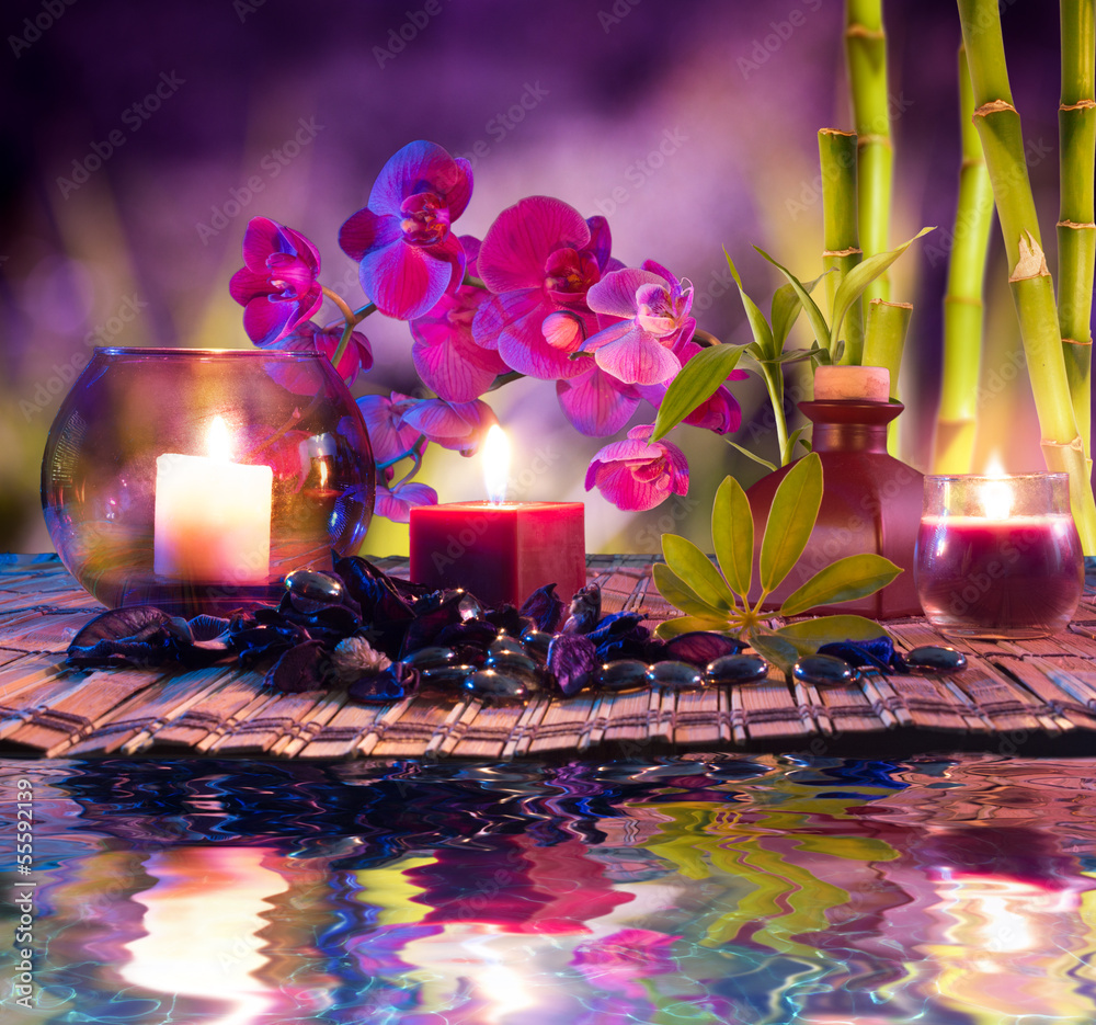 violet composition - candles, oil, orchids and bamboo on water - obrazy, fototapety, plakaty 