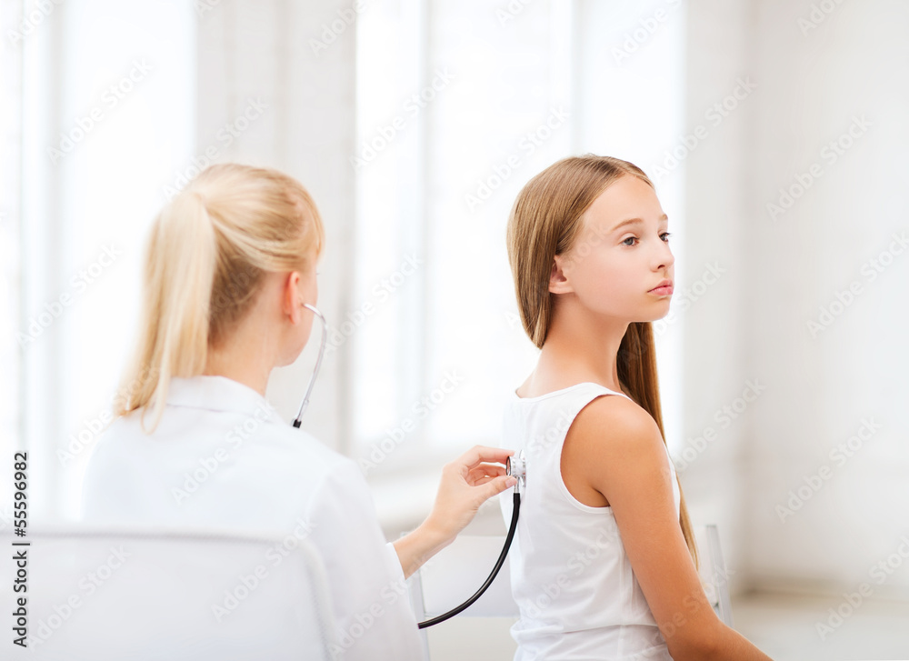 Fototapeta premium doctor with stethoscope listening to the patient
