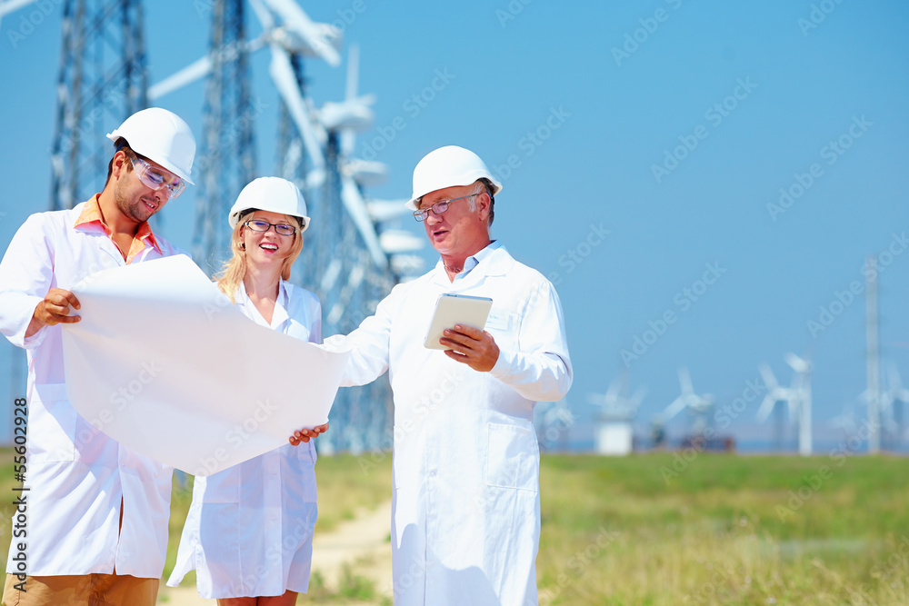scientists discussing project on wind power station scientists discussing project on wind power station