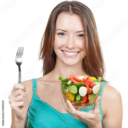 woman holding plate of fresh vegetables photo