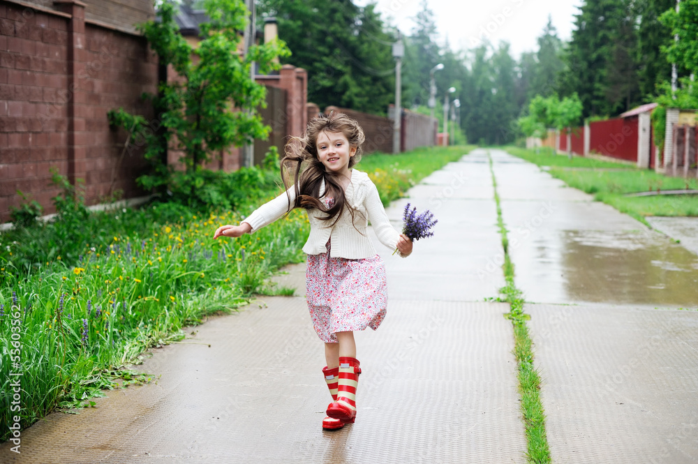 Elegant child girl walking on a rainy day Elegant child girl walking on a rainy day