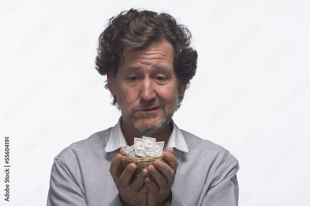 Sad man with this nest egg (money), horizontal Sad man with this nest egg (money), horizontal