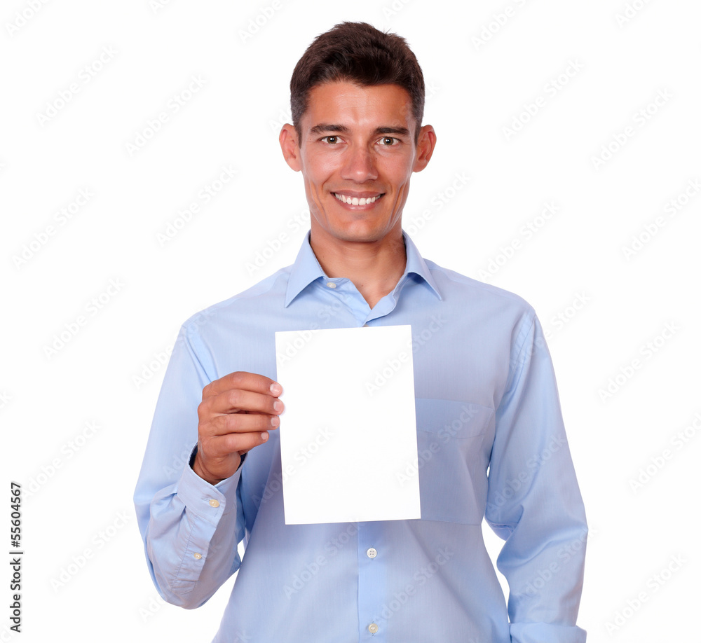 Fashionable hispanic guy holding white card Fashionable hispanic guy holding white card