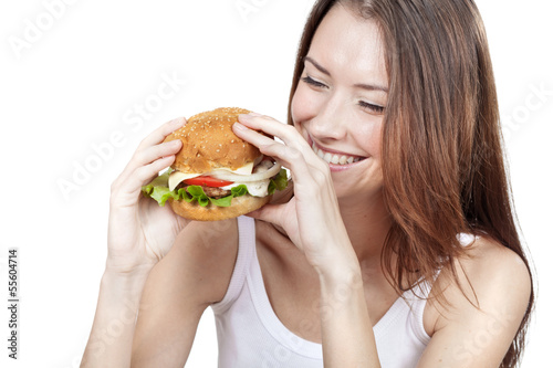 Beautiful young woman holding hamburger