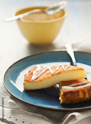 Slices of Baked Ricotta Cake with cream
