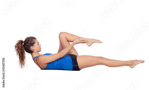 Attractive woman doing pilates exercises