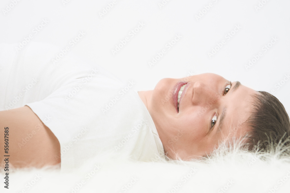 Portrait of happy Caucasian handsome man lying on floor and smil Portrait of happy Caucasian handsome man lying on floor and smil