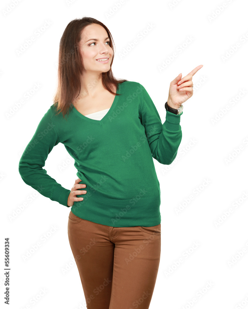 Portrait of a smiling young woman pointing up Portrait of a smiling young woman pointing up