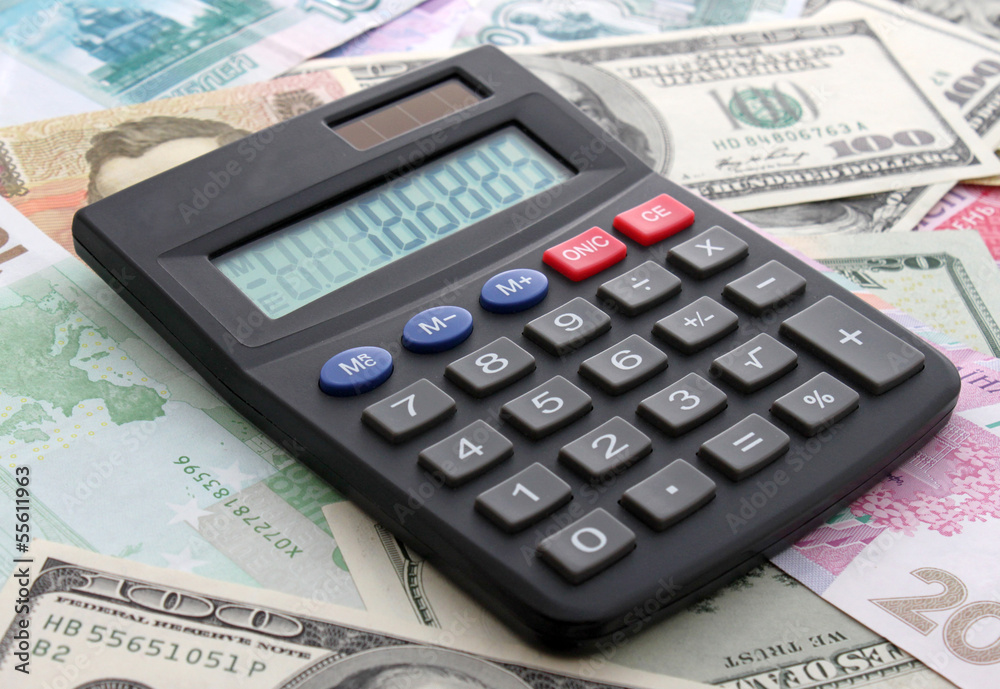 calculating cash: calculator on banknotes calculating cash: calculator on banknotes
