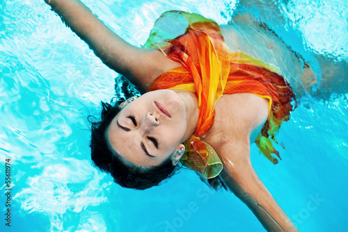 Chilling girl in the swimming pool
