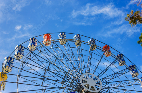 ferry wheel under bright blue sky photo