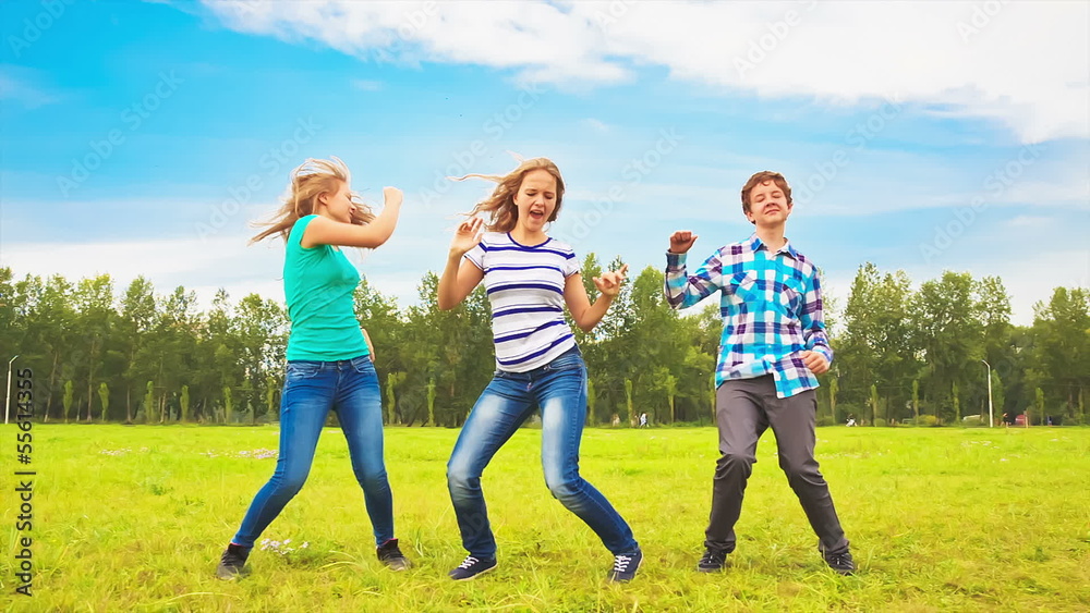 Teens dancing in a meadow Teens dancing in a meadow