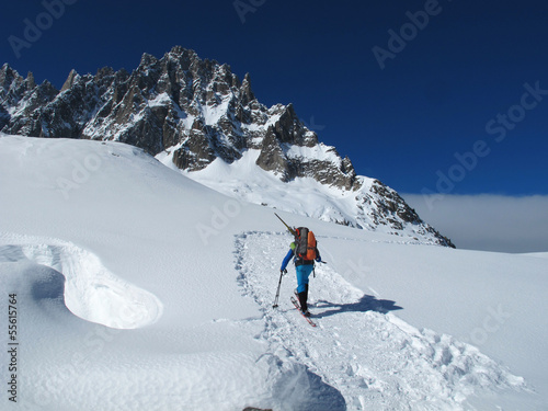 Young man doing ski touring in winter Alps